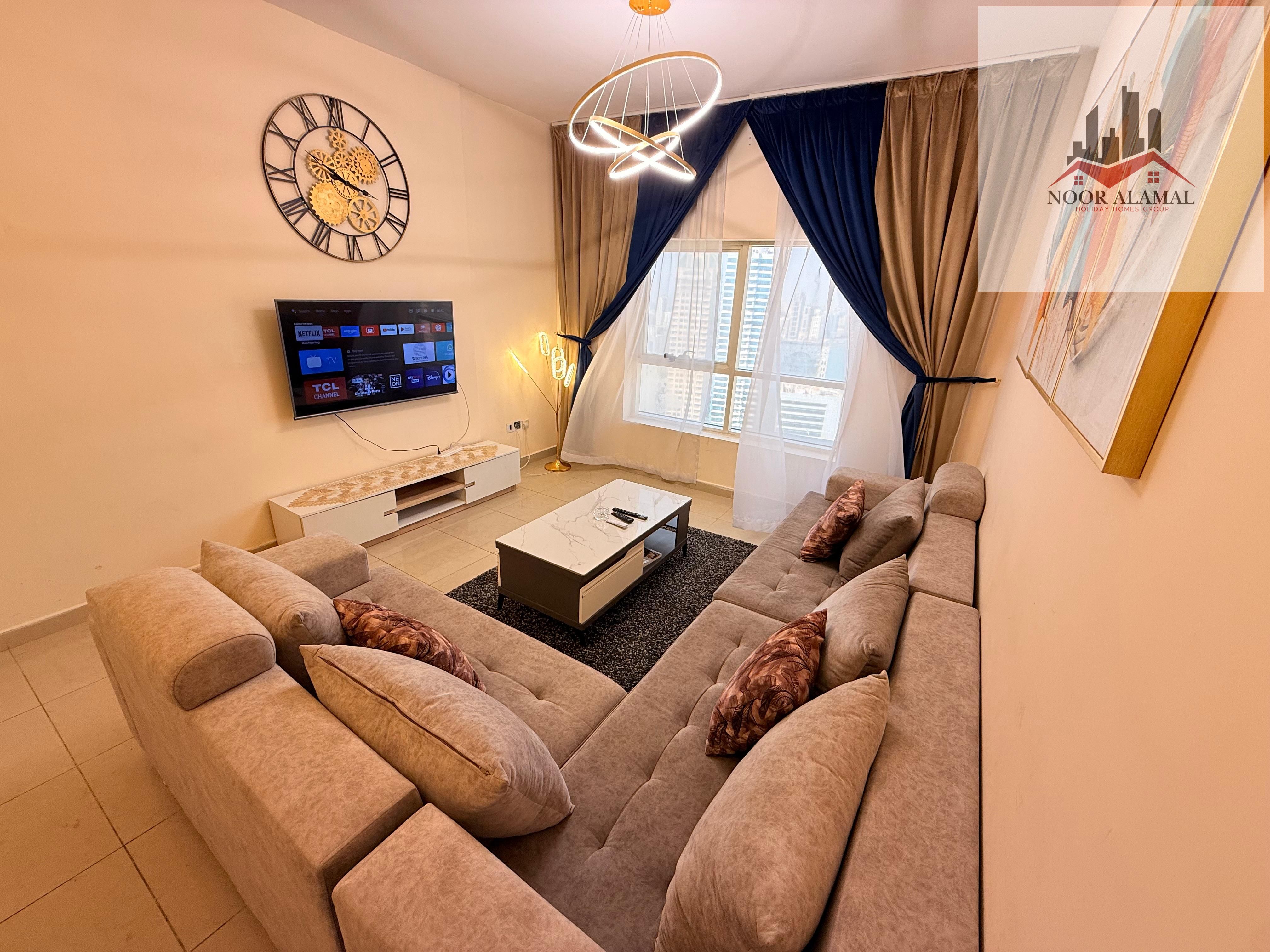 Sharjah Al Khan, two-bedroom apartment, hall, kitchen, 4 bathrooms, and maid's room