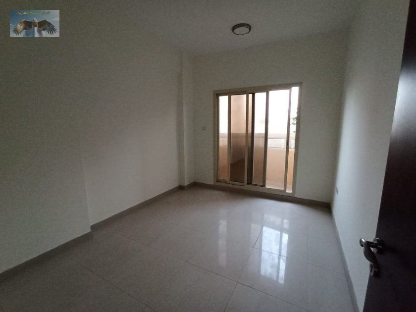 2BR apartment for rent in Al Rashidiya 3, with balcony, central AC, near Ajman One Towers and Corniche. Annual rent AED 35,000.