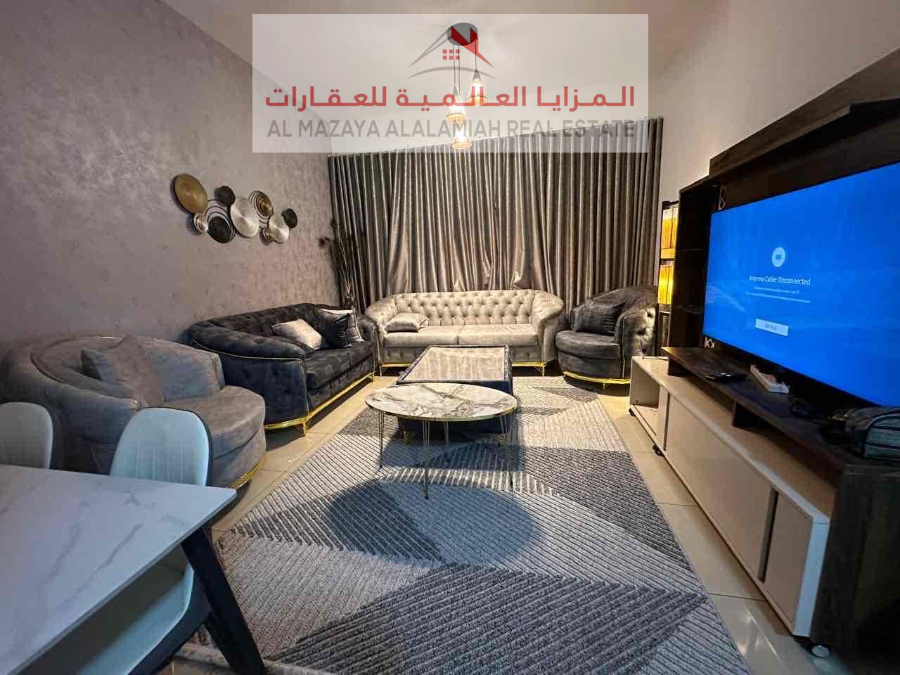 Monthly rent in Al Taawun, furnished room and hall, close to the second Dubai exit, inhabited