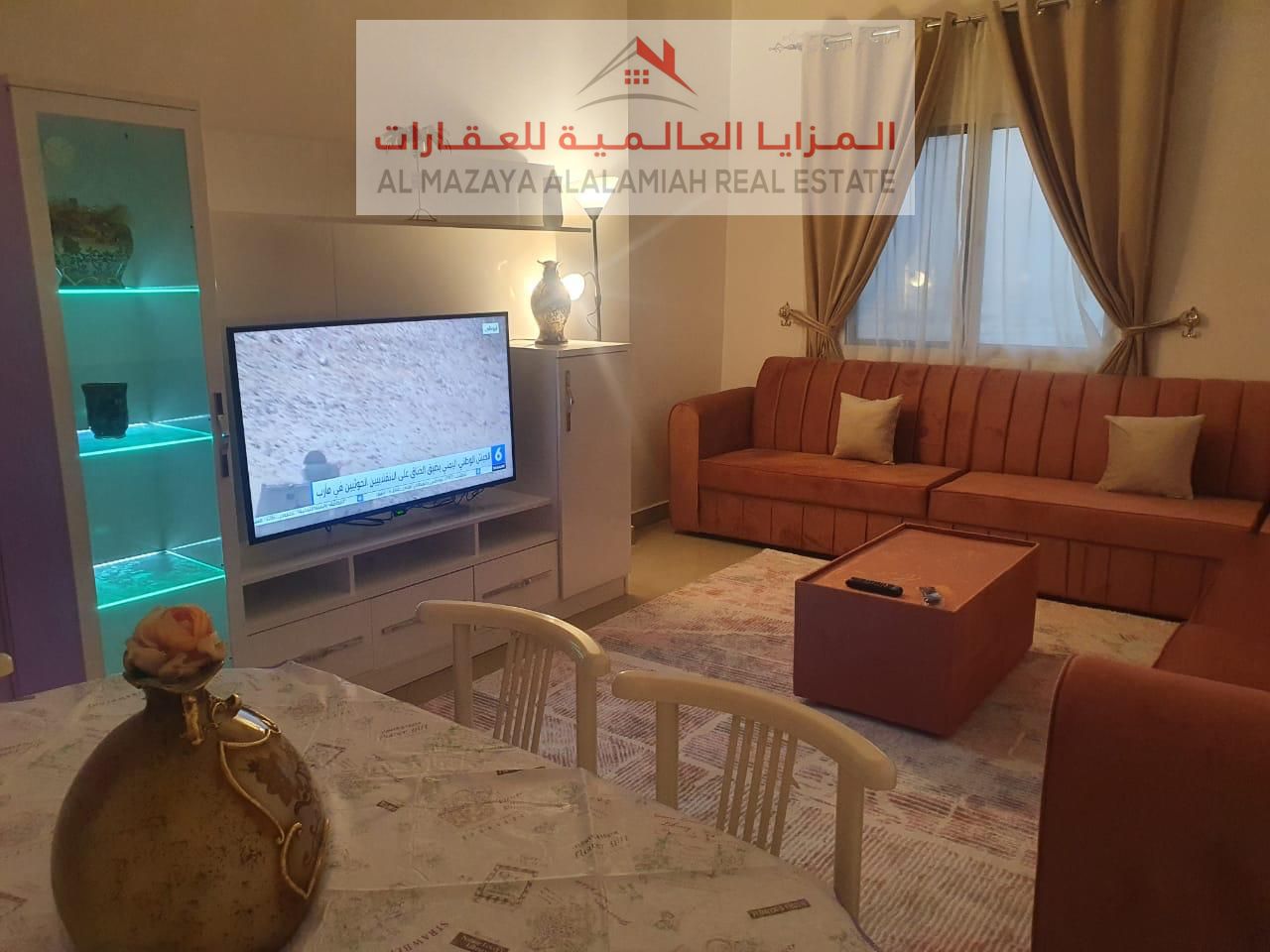 A fully furnished two-bedroom apartment with a lounge in Al-Taawun for monthly rent with internet