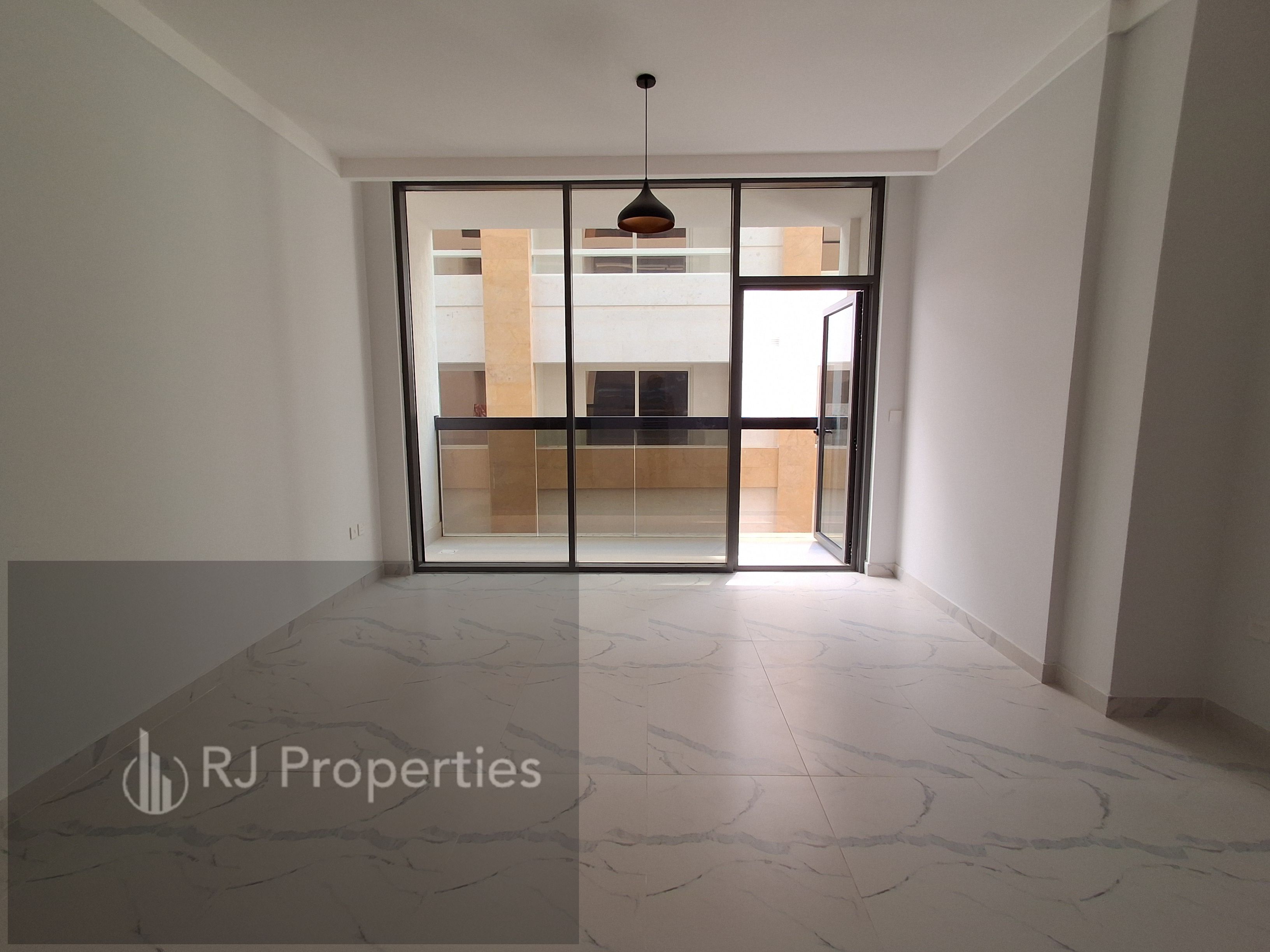 Brand New building - 1 BR apartment - balcony - wardrobes covered parking - school area