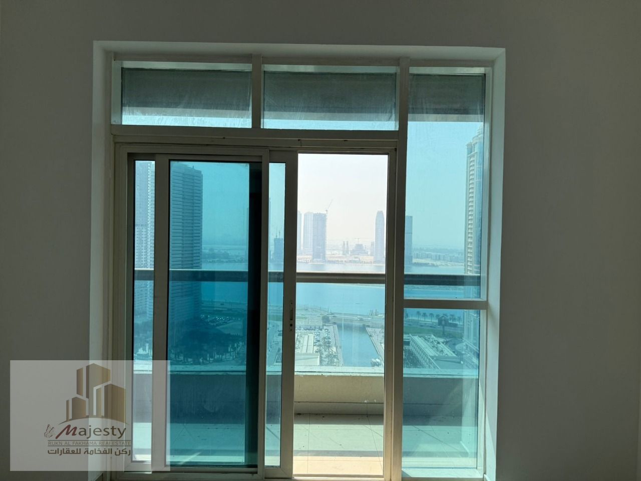 Apartment for Sale in Al Majaz 3 – Al Nakheel Tower 3 | 2BR + Hall with Balcony | Stunning View of Al Mamzar Lake & Al Qasba | 1119 sq. ft | AED 690,00