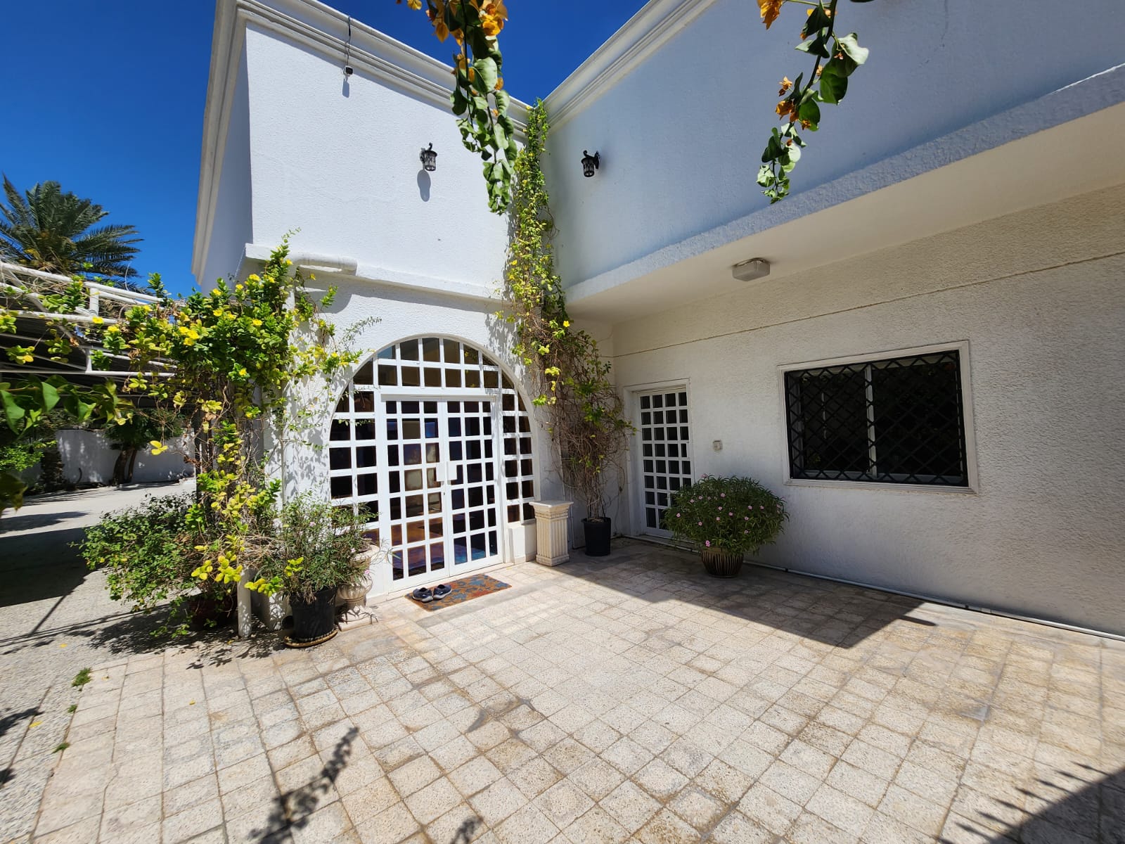 Villa for sale in Sharjah / Al Qadisiyah, second plot from the main street