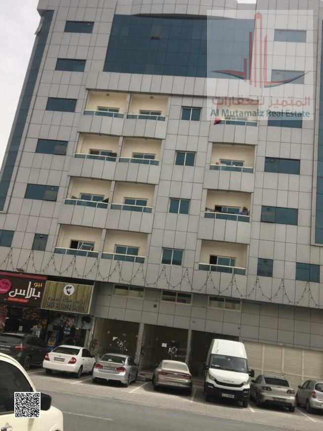 For annual rent in Ajman, two bedrooms, a hall, two bathrooms, and a balcony in the Ibrahim Al Ali building in Rawda 2. The required amount is 30,000