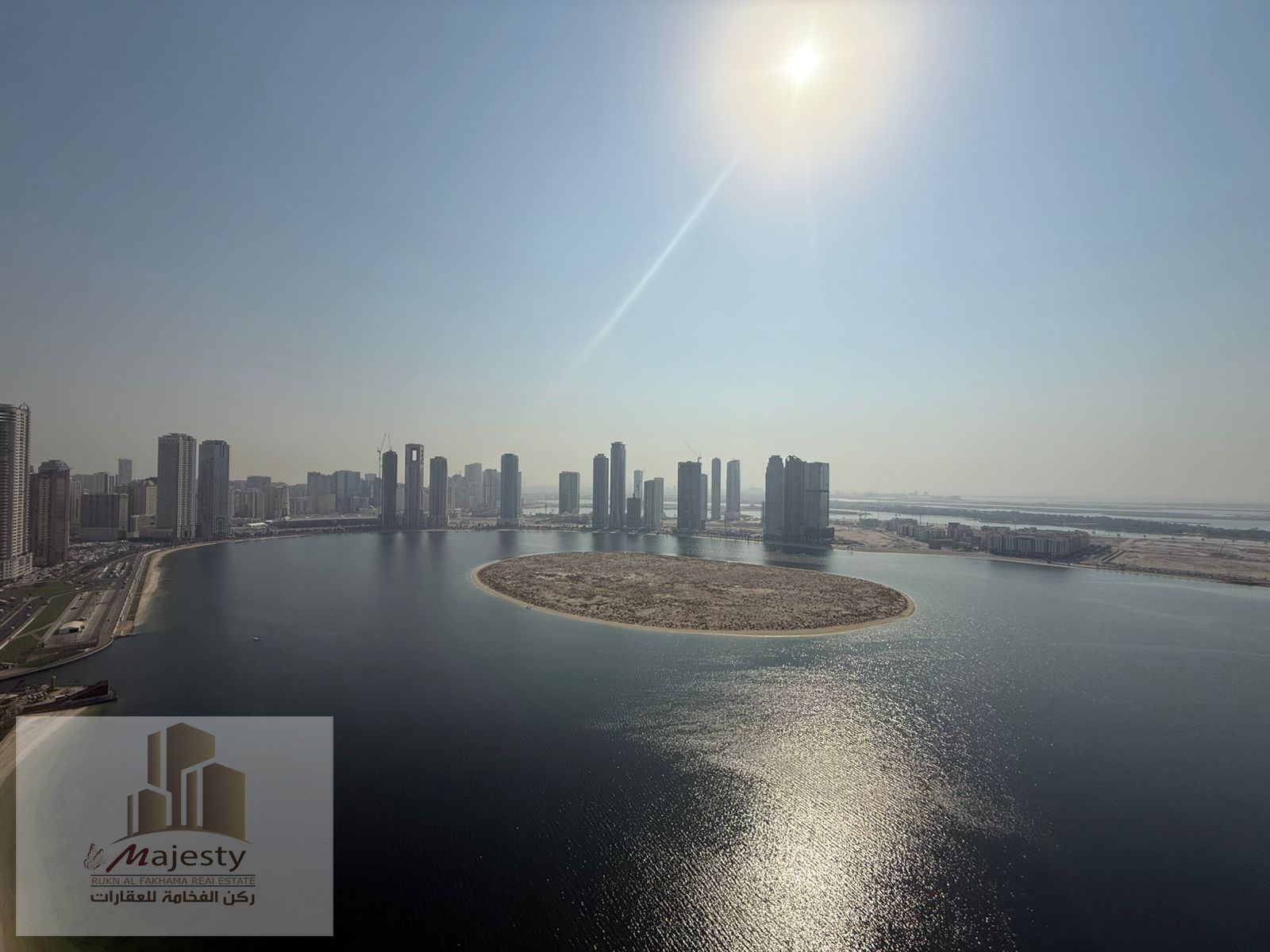 An apartment with a distinctive view of Al Khan Lake and a side open view in the Emirate of Sharjah, Al Khan area, first line on Al Khan Corniche.