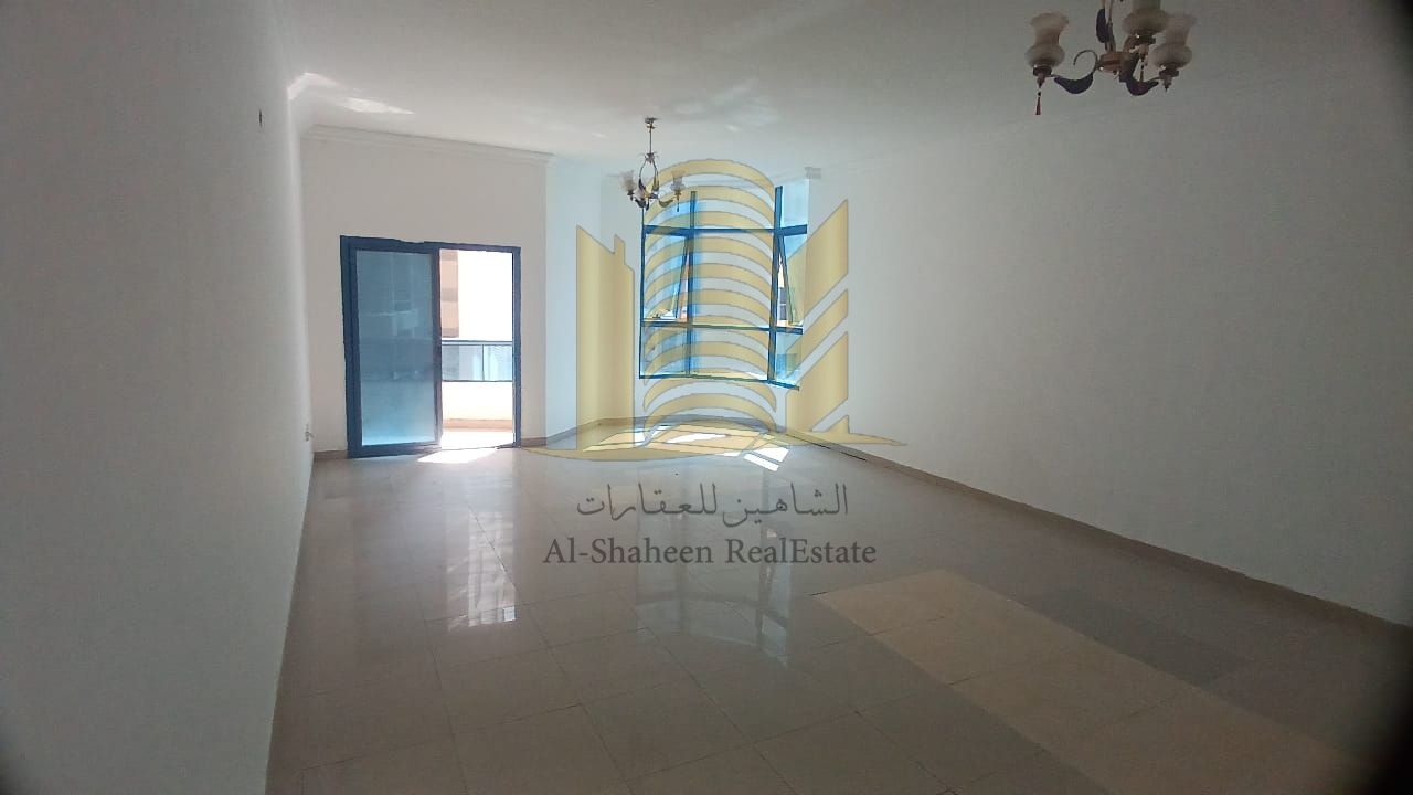 For sale, a two-bedroom apartment in the Pearl Towers, Ajman, Mina Street. Exterior view. 1,300 square feet. High floor. Central air conditioning. Very prime location. The towers feature gardens and excellent amenities. Spacious spaces, master bedrooms, a