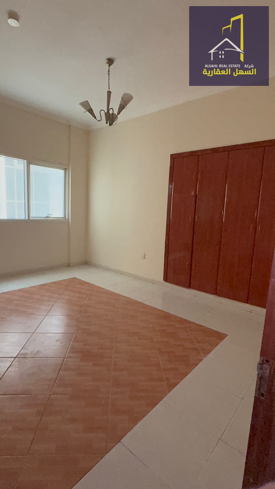 "Two-bedroom apartment with hall, free AC, and parking in Al Qasimia Al Nud area – Prime location and great price