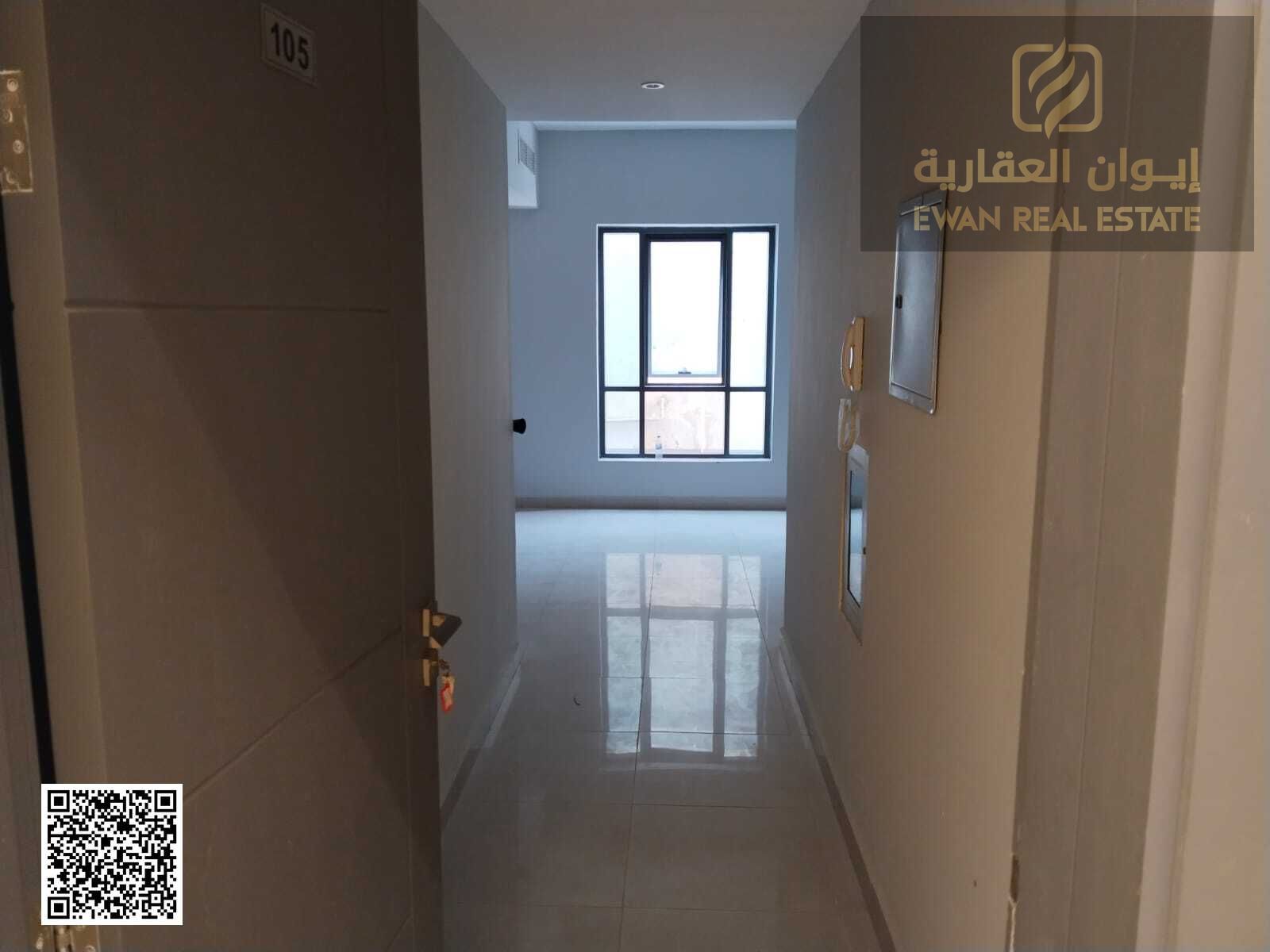 Studio for annual rent in Ajman Al Rashidiya, 560 sq ft, with central air conditioning, a bathroom, a kitchen, in a new building close to all services
