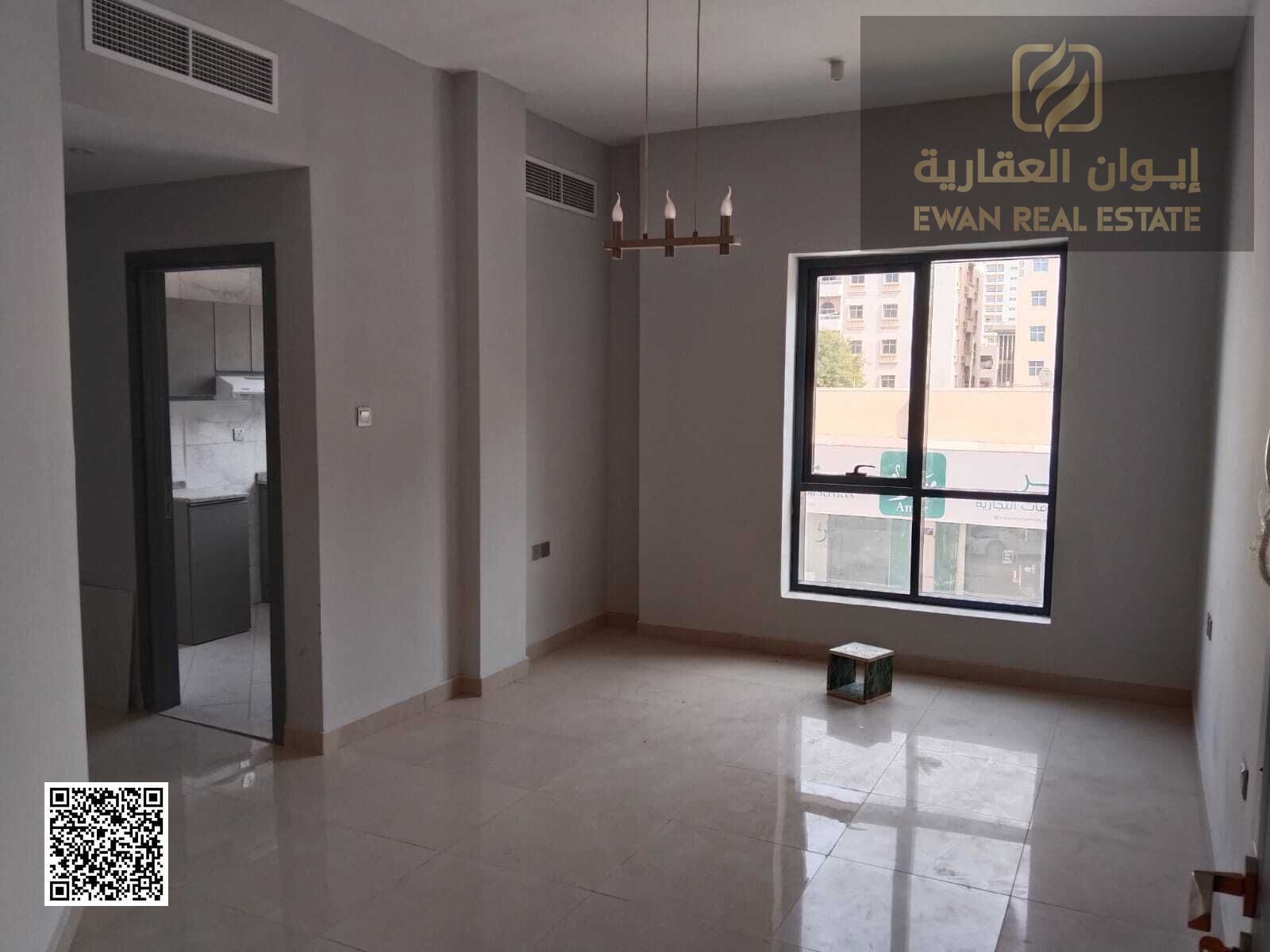 One bedroom apartment with a hall, bathroom and kitchen for annual rent in Ajman Al Rashidiya with central air conditioning and security services clos