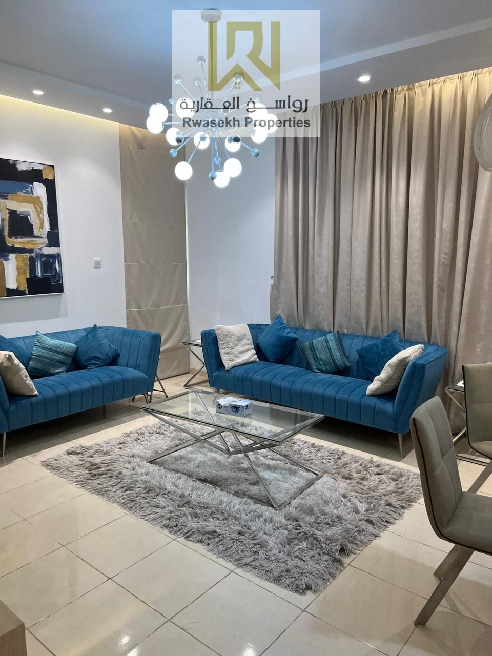 Real estate investment opportunity in Orient Towers, Ajman - 2 bedroom and hall apartment for sale with easy monthly installment plan.