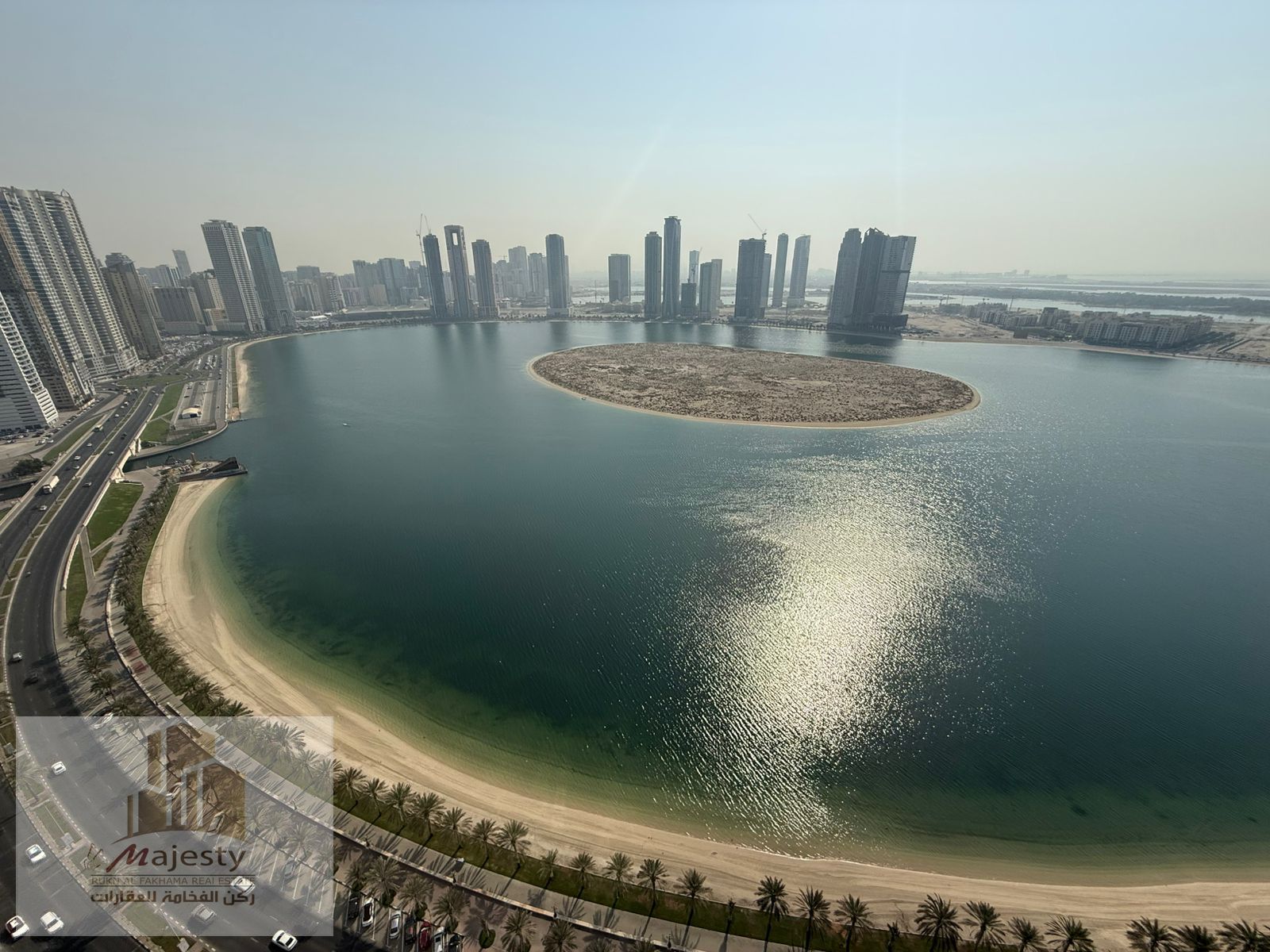 Apartment for sale in Sharjah, Al Khan area, with a front view of Al Mamzar Corniche