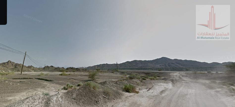 Residential and commercial land for sale in Masfout 1 – corner of a street and alley, with a G+2 permit – at an attractive price!