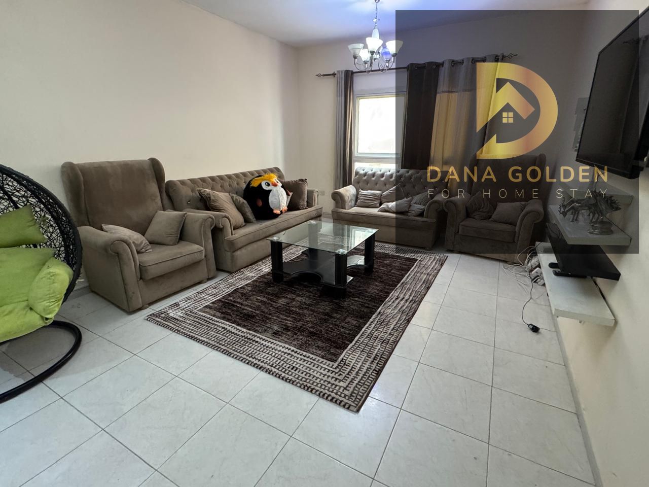 A large room and hall overlooking the main street, a balcony, two large bathrooms, furnished in Sharjah Al Taawun