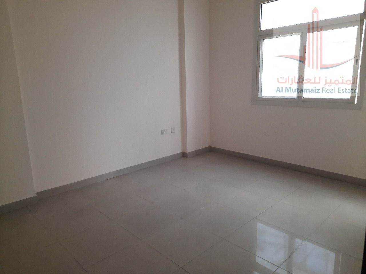 A room and a hall close to Al-Hikma School. Excellent location with easy access to Dubai and Sharjah