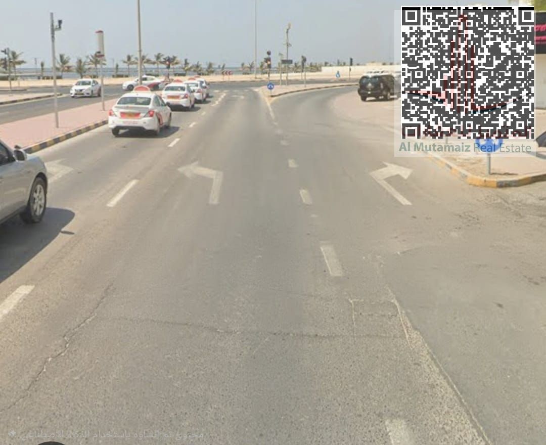For sale, residential and commercial land in Al Bustan, directly on Sheikh Abdullah bin Rashid Street