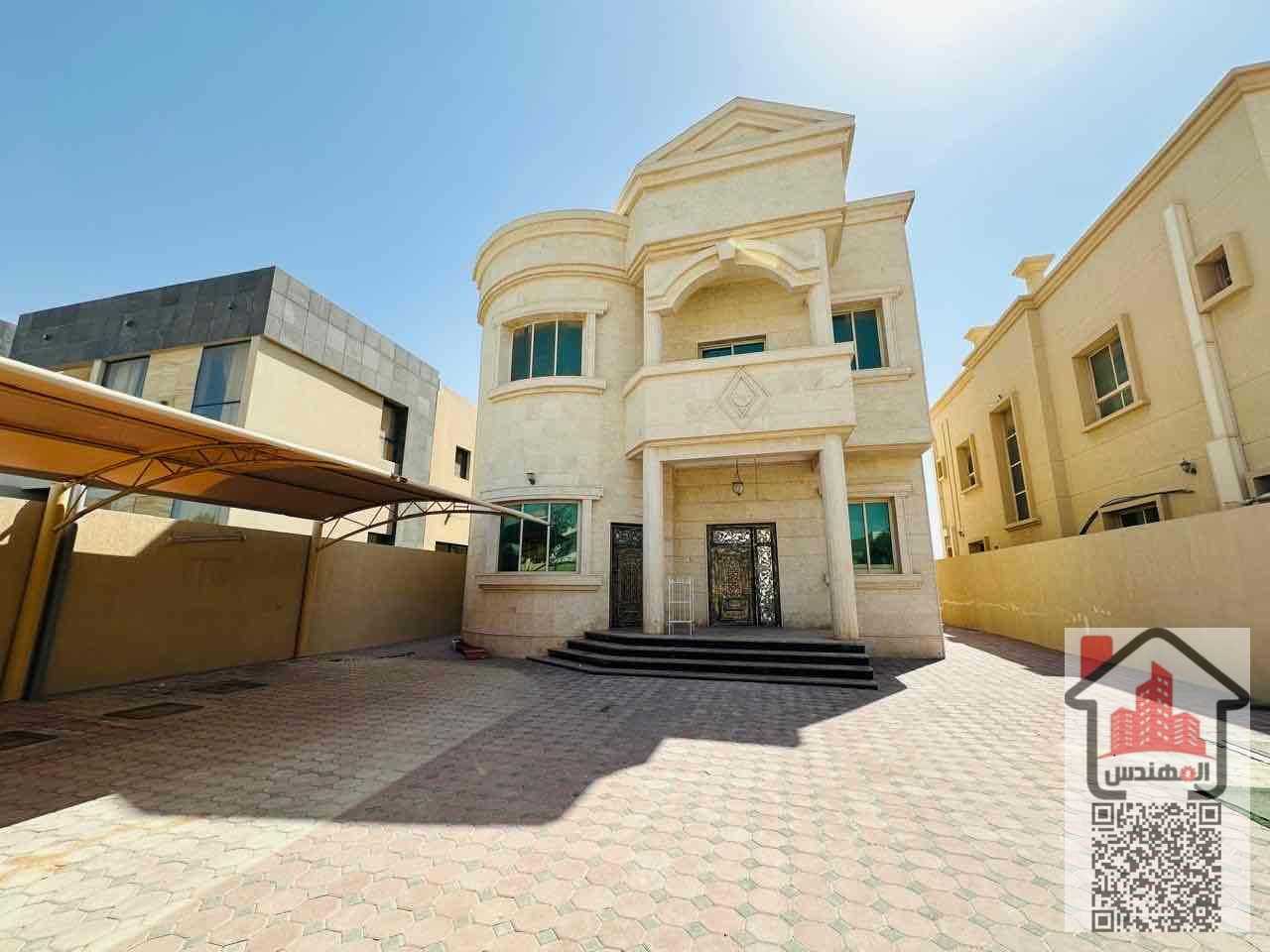 Villa for rent in Al Muwaihat 1 on the street Second occupant Area 5,000 sq ft Consisting of 5 master bedrooms, a living room, 2 halls, 2 kitchens, a maid's room, a storeroom, a spacious courtyard, a parking space, and a large setback in front of the vill