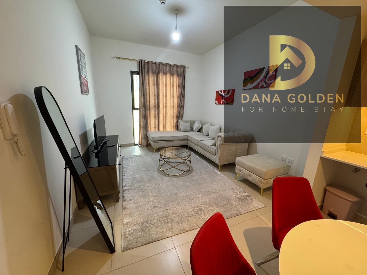 Room and hall in Maryam Island, Sharjah, overlooking the pool, with a balcony, luxurious furniture, gym, parking, and swimming pool.