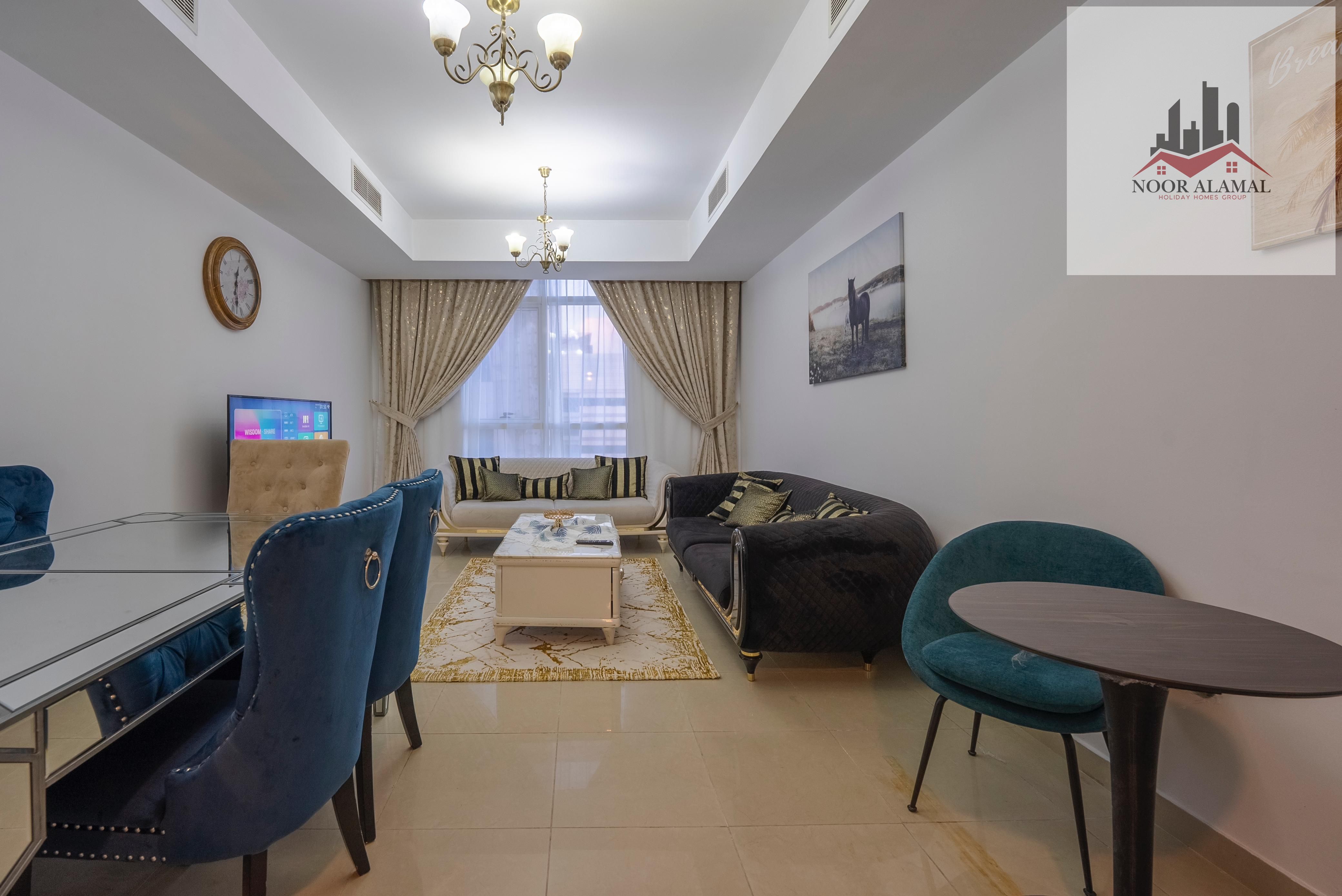 Sharjah, Al Khan, second floor, furnished, hotel room, hall, kitchen, and two bathrooms, direct lake view, price 6,500 with internet and parking