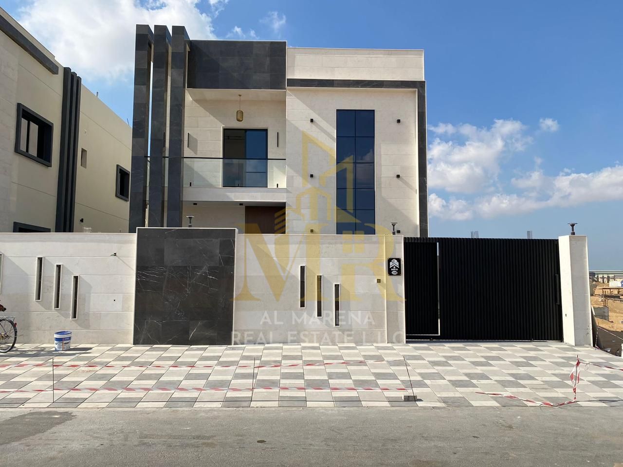 Villa for sale in Ajman, Al Helio 2 area, including registration and ownership fees, consisting of 4 master bedrooms with a majlis, a hall, and a maid