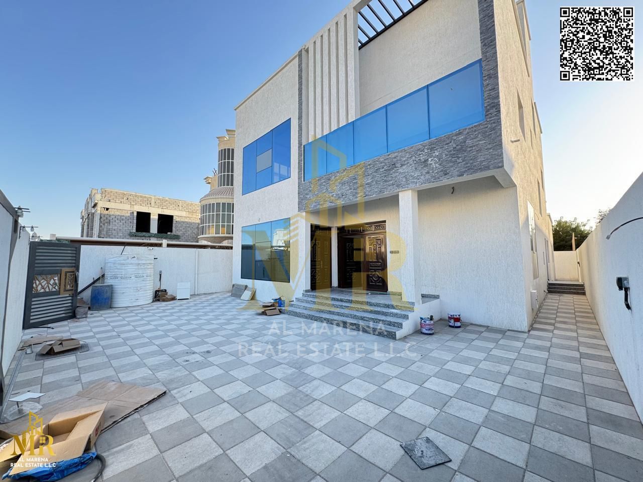 Corner 7 rooms and annex including electricity and water, first resident, freehold for all nationalities in Al Muwaihat 3 area