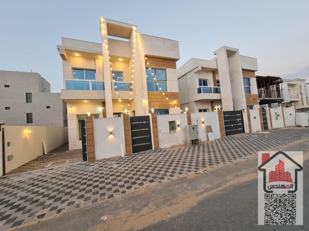 Villa for rent in Ajman, Al Zahya area, consisting of two floors, a council, a hall, a kitchen, five master bedrooms, a maid's room, and a garage for cars. The price is 110, negotiable.