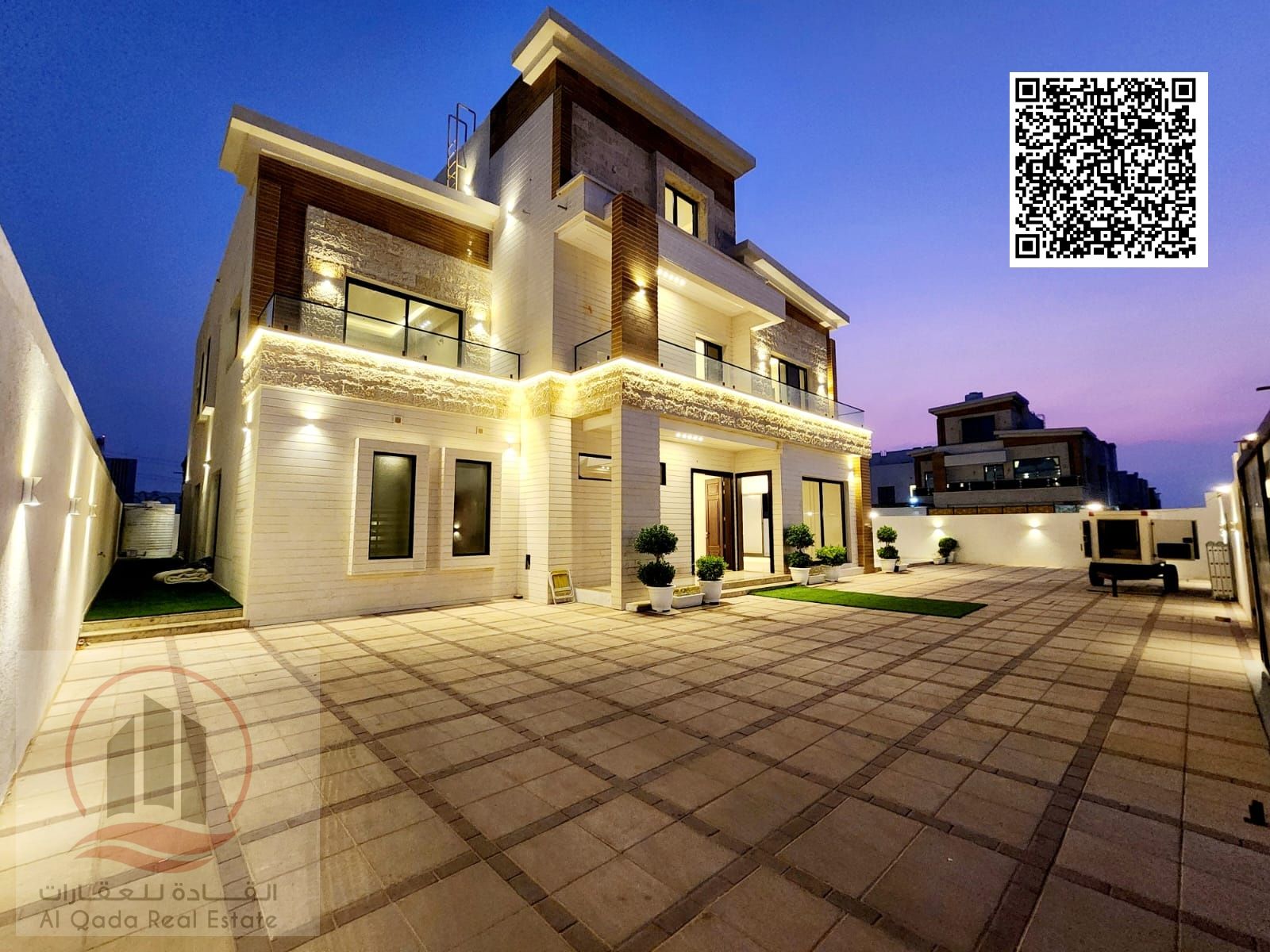 A corner villa for sale in Al Yasmeen, with an area of 8,100 square feet, consists of 8 master bedrooms, 2 living rooms, a maid's room, and a larg