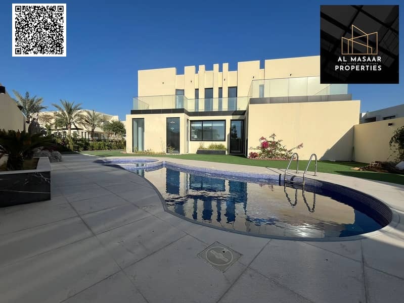 Luxurious villa for rent in Al Zorah! Four master bedrooms, a spacious living room, a back garden, a swimming pool, and a jacuzzi. Comfort and eleganc