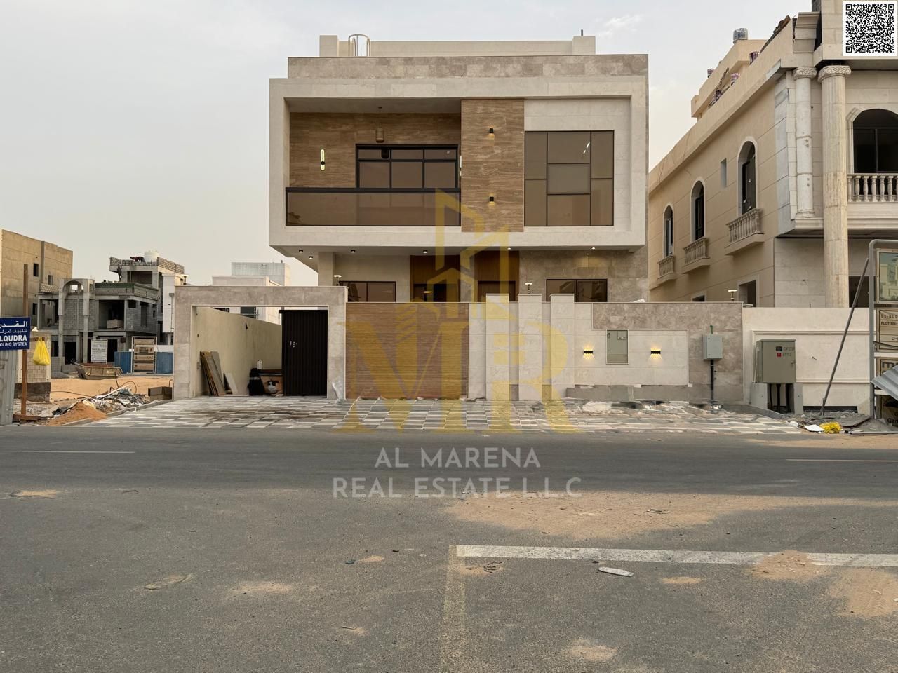 For sale luxury villa in Al Bahia - Ajman | Two floors + large roof | 7 master bedrooms + majlis + 2 halls + modern kitchen + maid's room | Land area