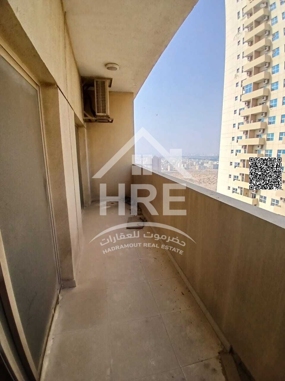 One bedroom apartment with balcony in Emirates City, an ideal choice for housing and investment.
