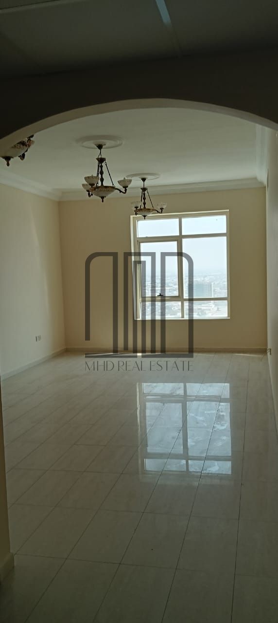 Prime Location | Spacious Flat in AlMaha Tower, Sharjah Ac free with Parking