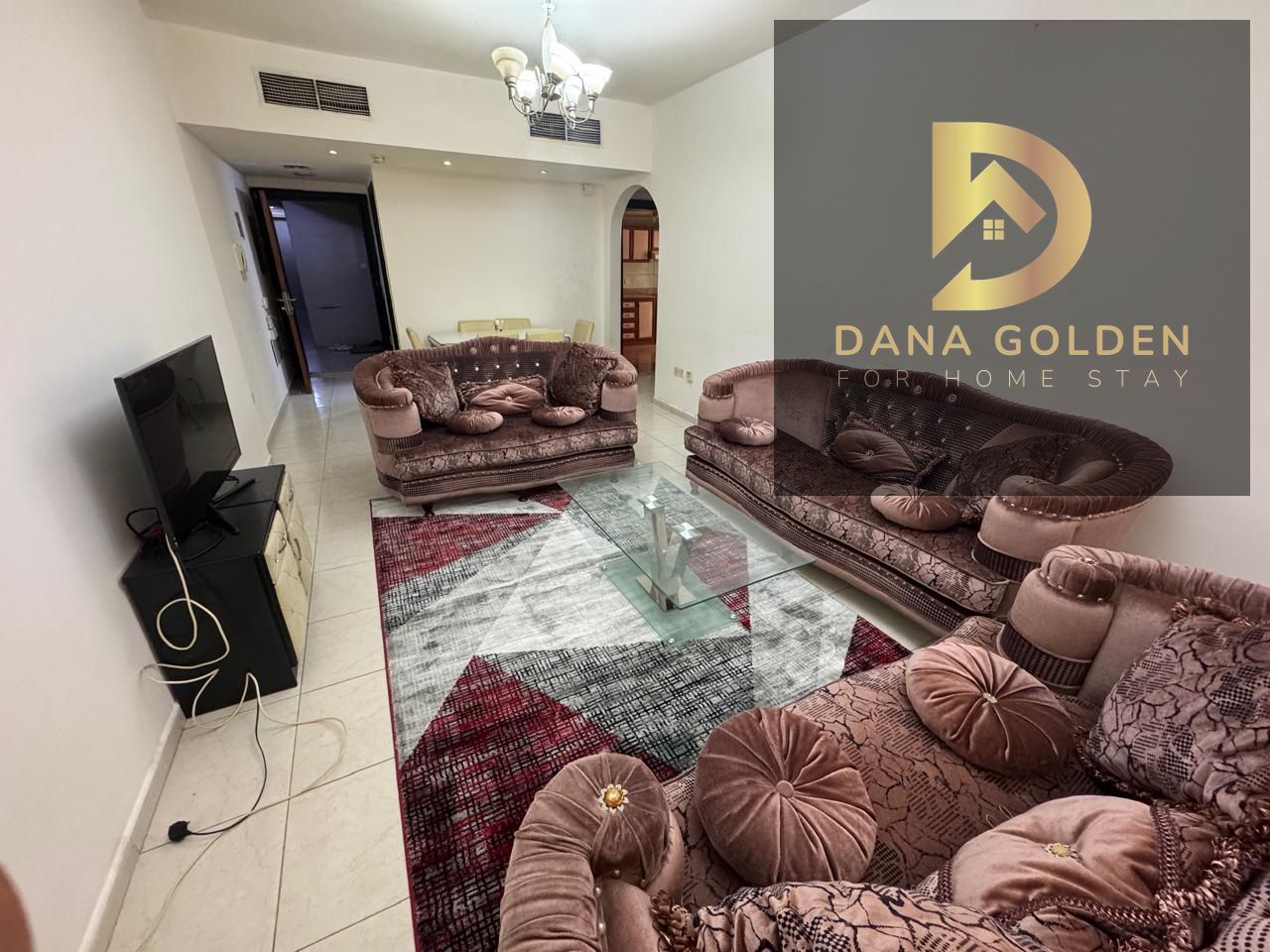 A spacious one-bedroom apartment with a balcony, two large bathrooms, and luxurious furnishings, overlooking the main street.
