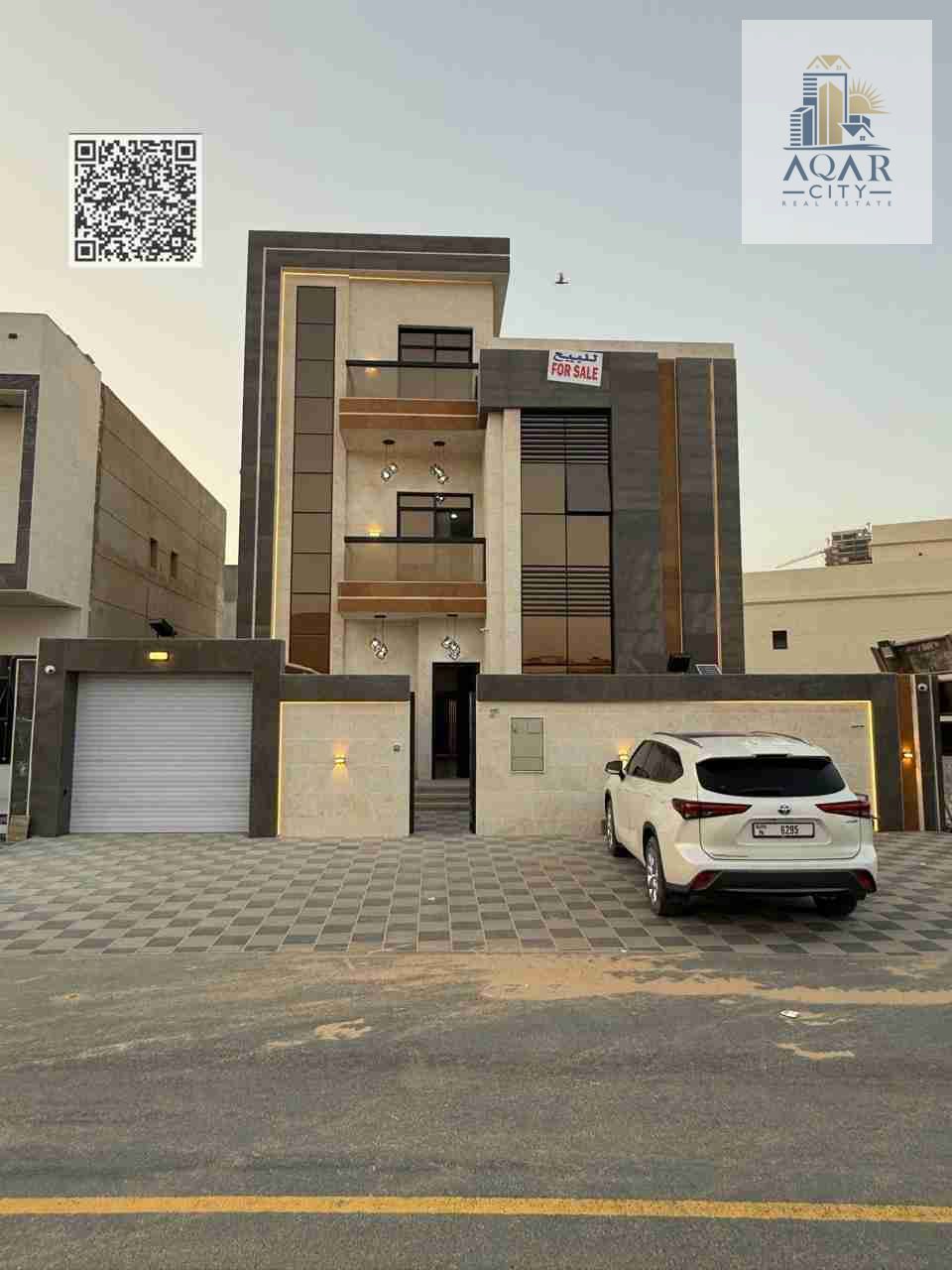 A modern villa with a distinctive modern design and high-end finishing is for sale, with two floors and a roof, at a price that includes registration fees and air conditioning.