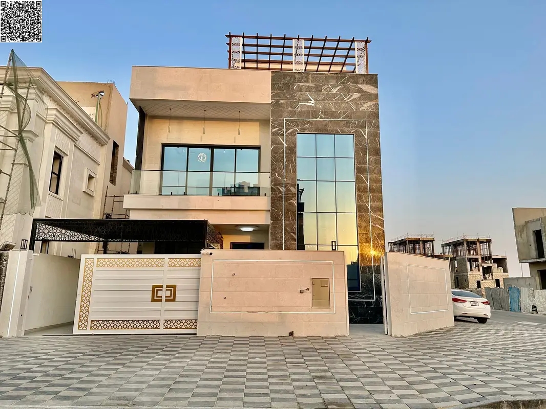Corner villa, price inclusive of registration and ownership fees, on the main street, ready to move in, in one of Ajman's most prestigious areas, free
