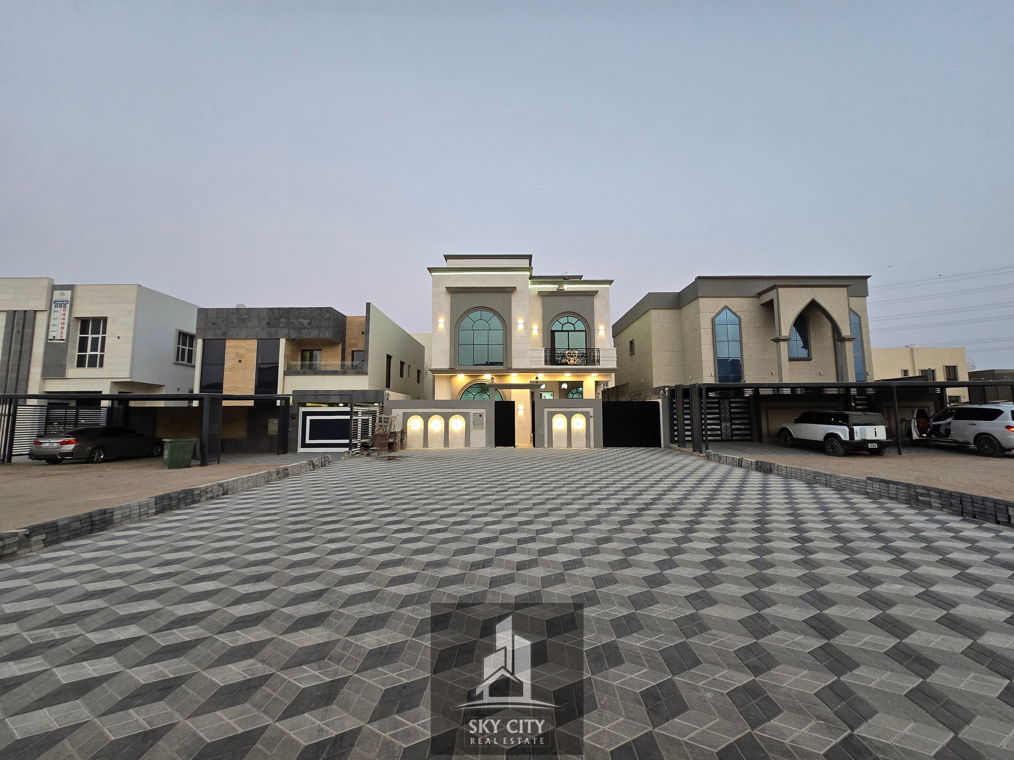 For sale: A villa on a main street with luxurious finishes, close to Sheikh Mohammed bin Zayed Road - Freehold for all nationalities for life - with e