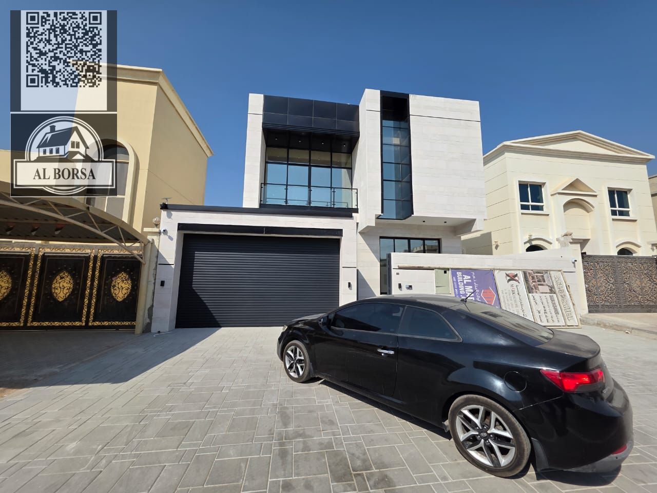 Super deluxe villa for sale in Al Yasmin, with an internal staircase, consisting of 5 master bedrooms, a majlis, a living room, and a maid's room.