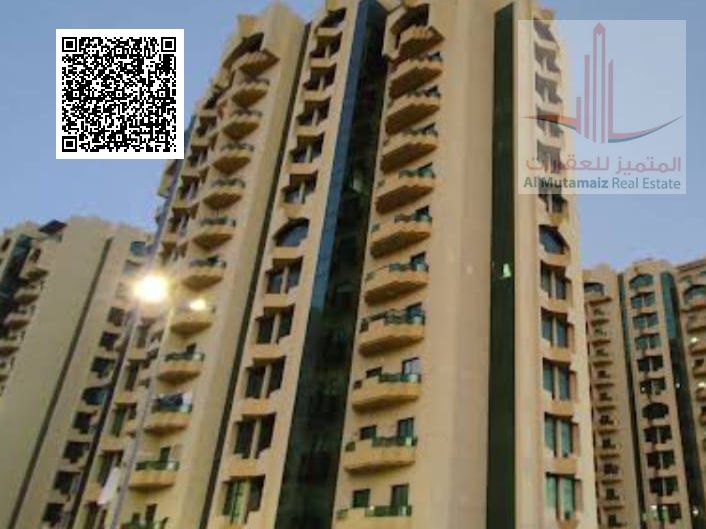 Two bedrooms and a living room for sale in Al Rashidiya Towers, open view with a wall-mounted alcove, at a bargain price.
