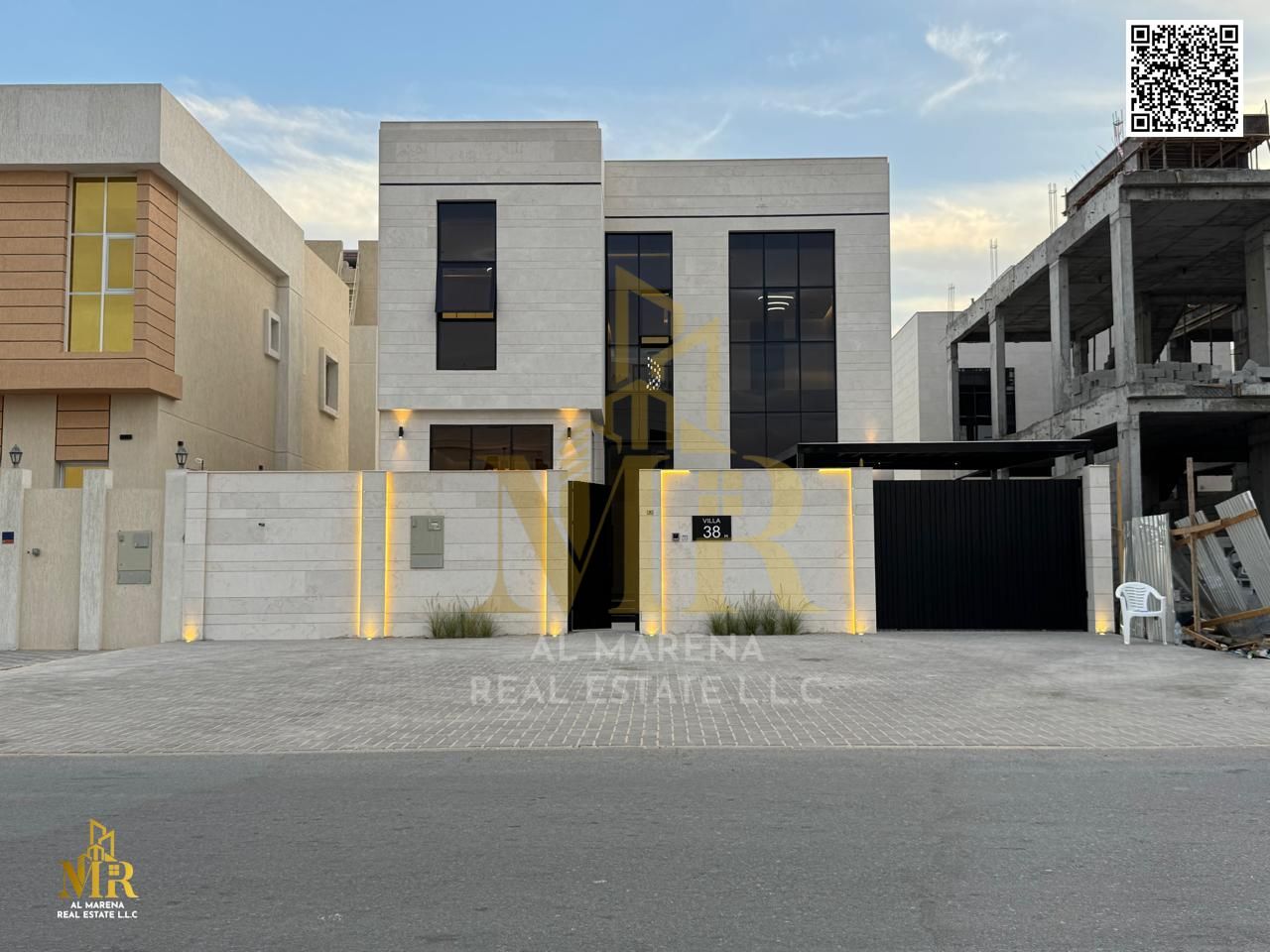 For sale: A luxurious villa in Al Zahiyah area, Ajman, two floors and a roof, priced at AED 1,500,000, with a modern design.