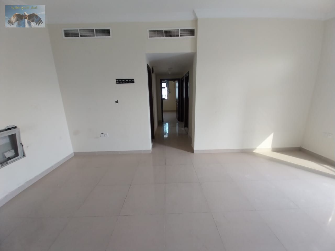 Spacious two-bedroom apartment for rent in Al Naeemia 1, Hafez Ibrahim Street, near markets and Al Ain Hotel, featuring balcony and private parking