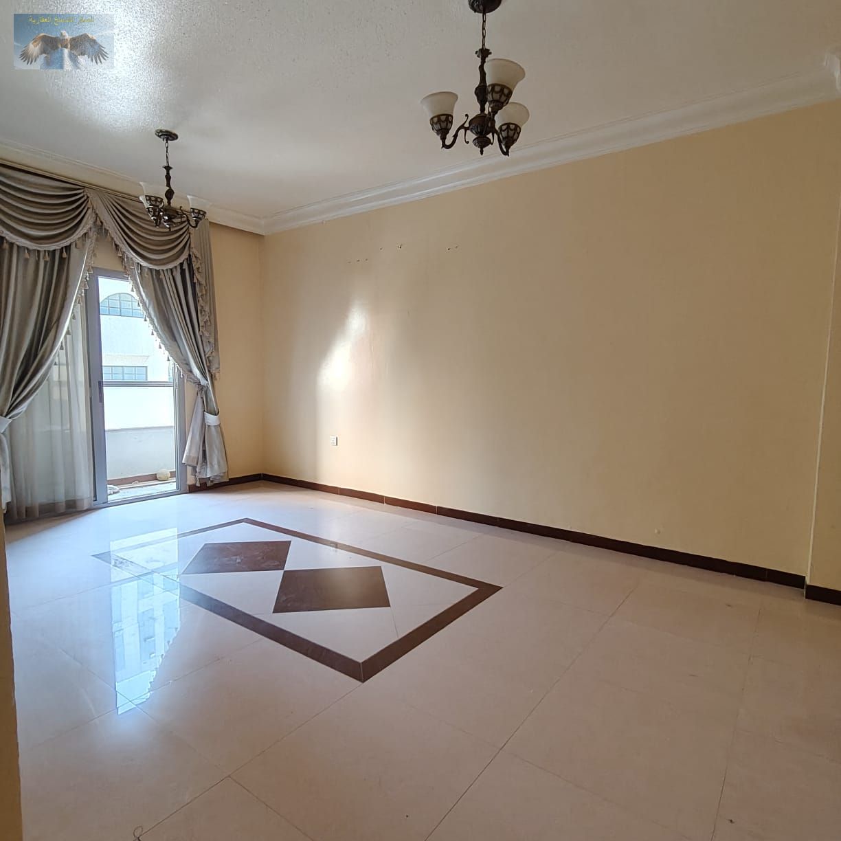 Spacious one-bedroom apartment for rent in Al Naeemia 1 near Gulf Bridge & Khalifa Street, featuring central AC, balcony, and separate living area