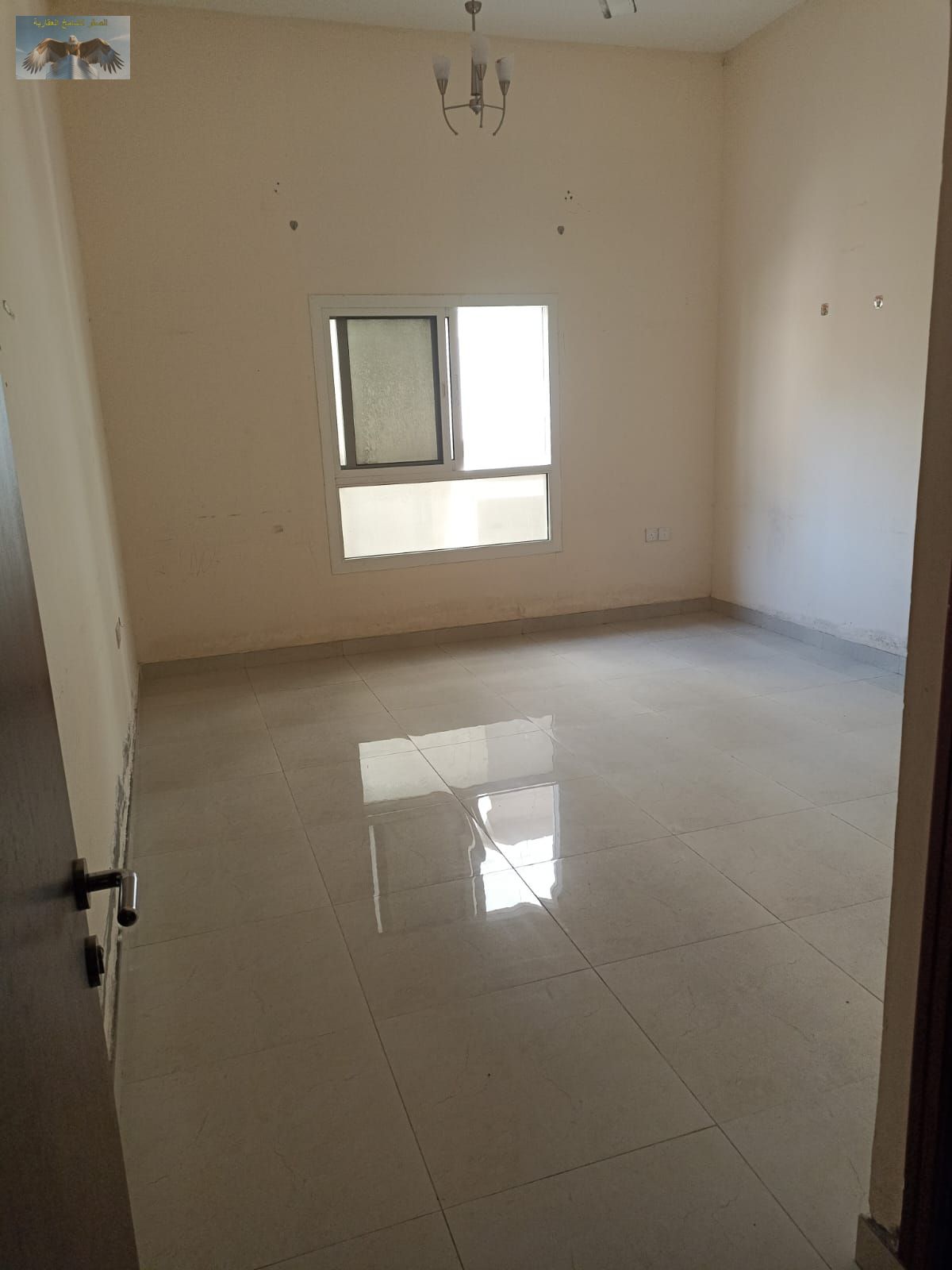 One-bedroom apartment for rent in Al Rashidiya 2 opposite Etisalat Center, with 2 bathrooms and central AC, excellent location near all services