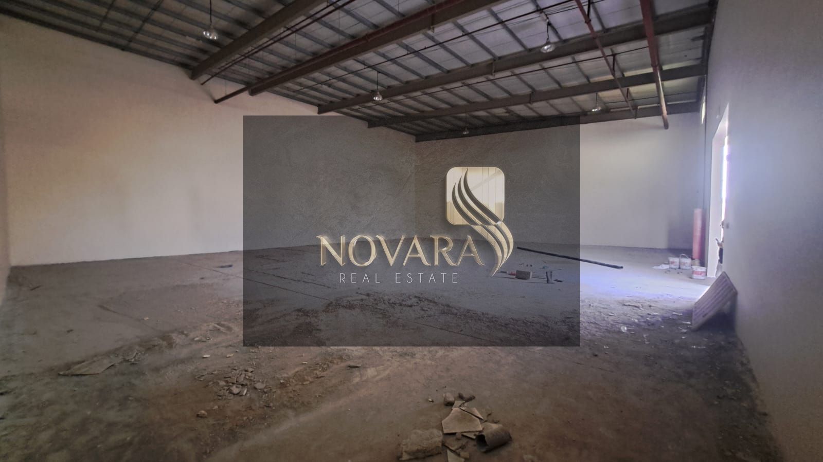 A great opportunity to rent a ready-to-use warehouse in a strategic location within Umm Al Quwain, featuring excellent specifications suitable for va