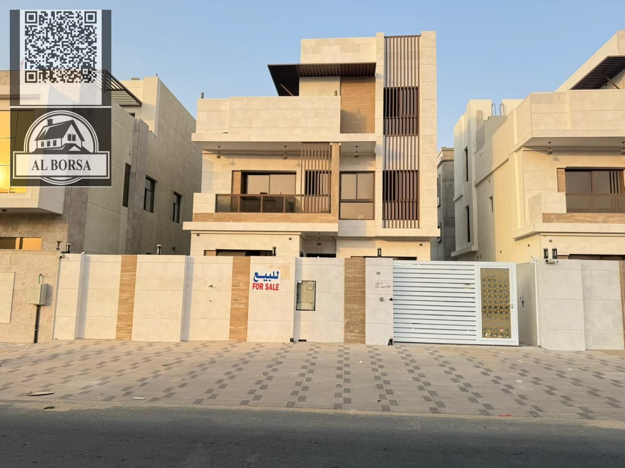 Villa for sale in Al Bahia, Ajman. 5 master bedrooms, large majlis, large living room, kitchen. 3 floors: ground, first, and roof.