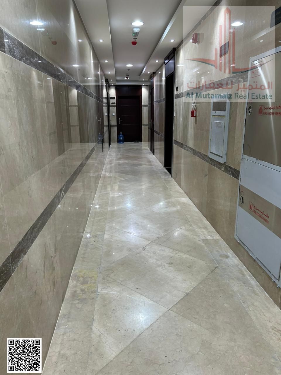 For sale in Ajman, a residential/commercial building in Al Hamidiya, corner lot on two streets, 7600 sq ft, ground floor + 8 floors.