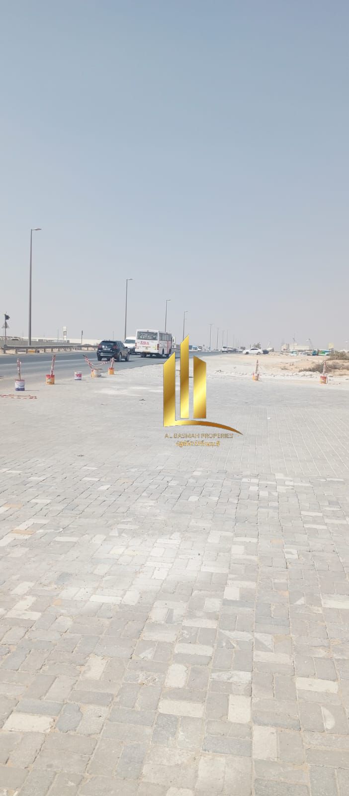 For sale: Fenced land in the Sajaa area, on Main Street No. 97 and Street 60. Its area is 21,806 square feet.
