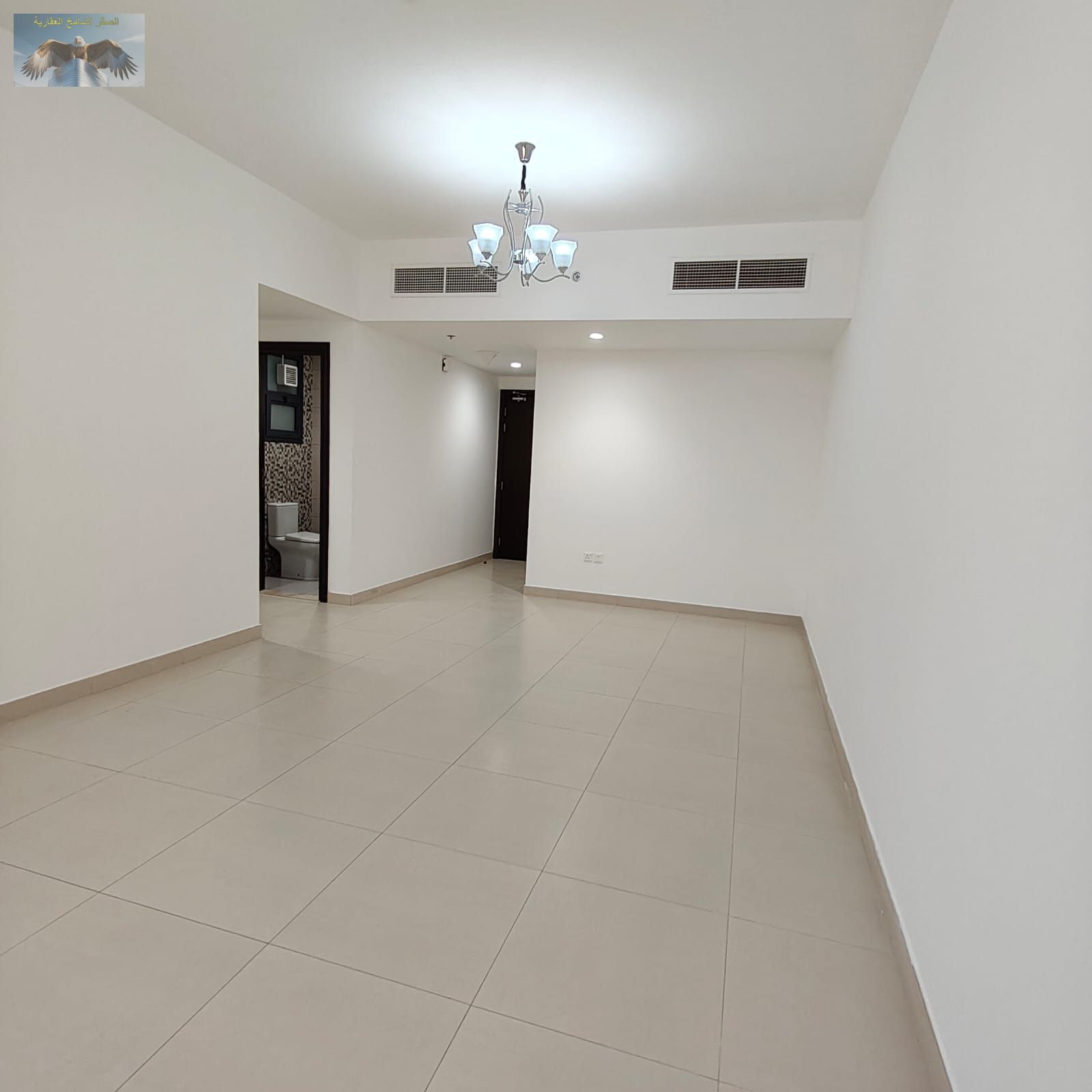 The most beautiful two-bedroom apartment with a living room for annual rent in a very clean building, featuring private parking and built-in wardrobes