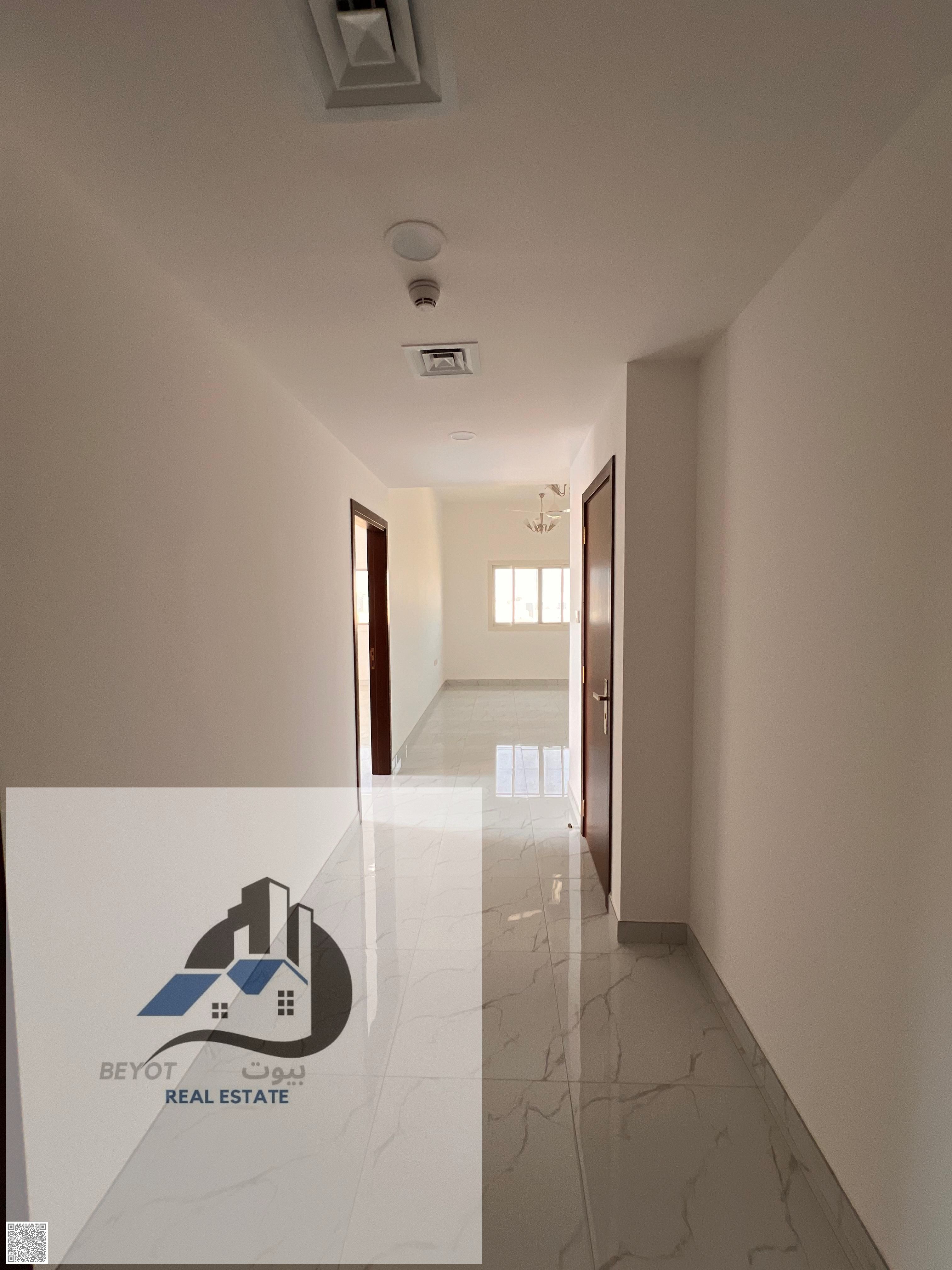 For annual rent: One bedroom, living room, two bathrooms, central air conditioning, brand new, second floor, spacious, prime location, Al Muwaihat 3