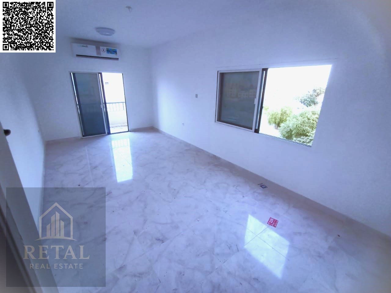 For annual rent: a two-bedroom apartment with a living room and an open view of Ajman Corniche.
