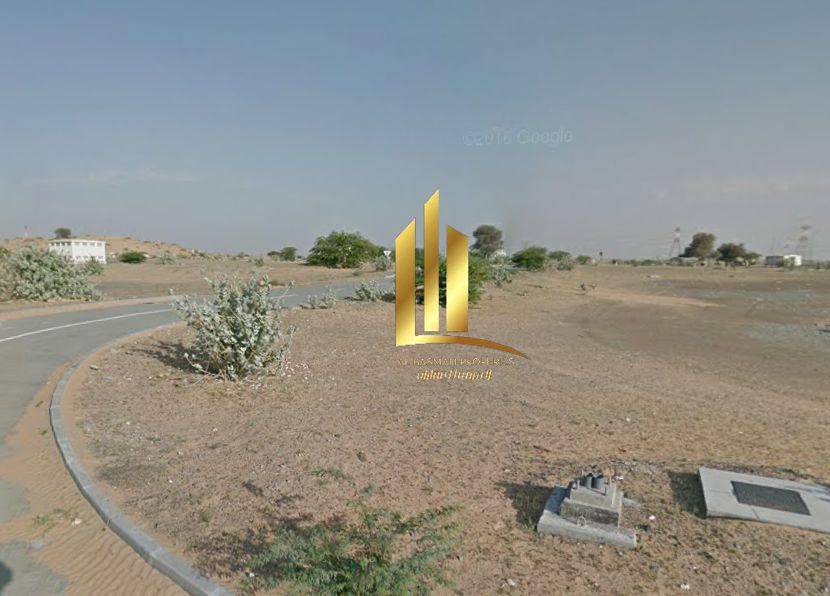 Industrial land for sale in Al-Arqoub, corner plot on a main road.