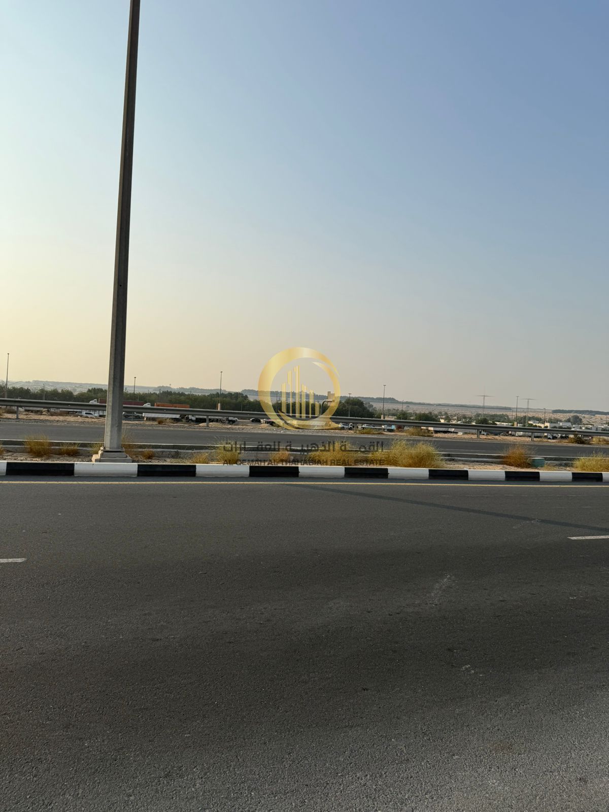 For sale: a very special land on the hills, directly on the main street, easy access in and out of the Emirates, opposite the Masar project.