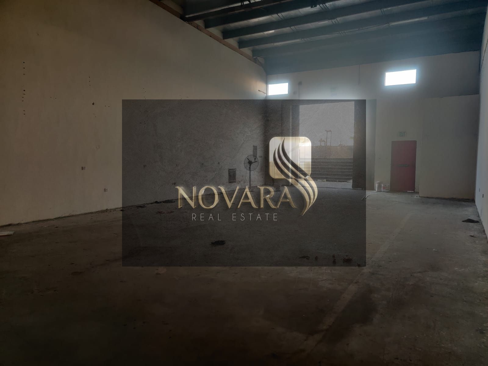 A premium warehouse is available for annual rent in Al Jurf Industrial Area 3, Ajman. It features a strategic location and a practical design suitabl